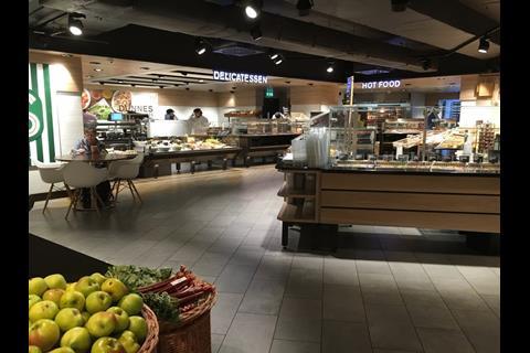 The bright delicatessen and hot food counters form a focal point of the new-look store.